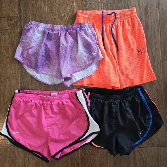 Nike Women's Active Shorts Size Medium 4 Pair Pink Purple Orange Black - Picture 1 of 8